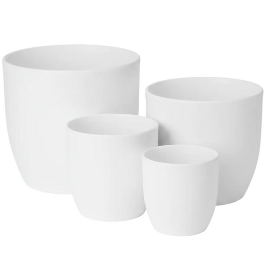 Three matte white ceramic planters in graduated sizes arranged together on a plain white background.